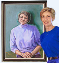 Carol Hawkins poses, at the Travis County Courthouse, with a commissioned portrait.